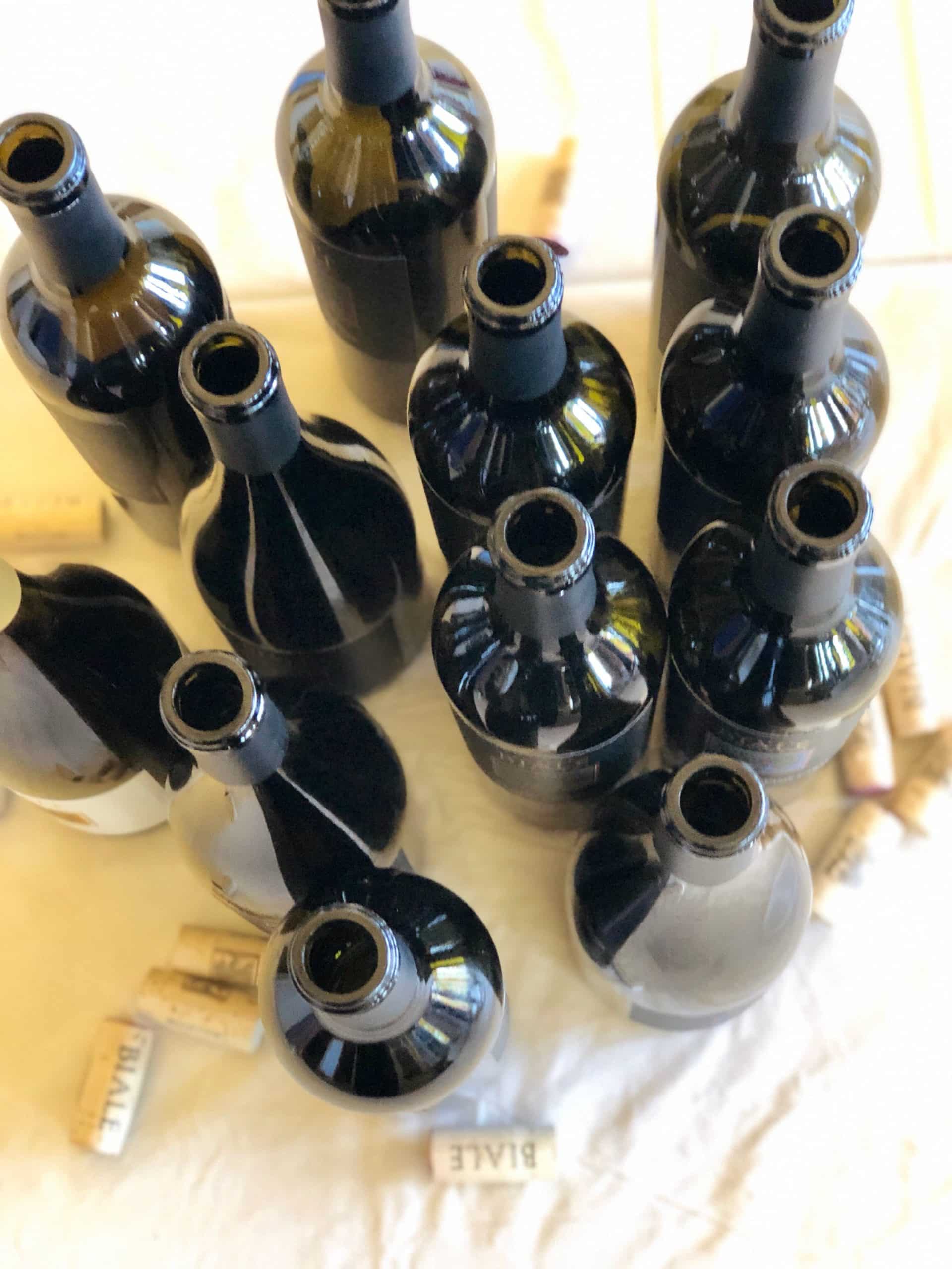 a cluster of open Biale wine bottles from above
